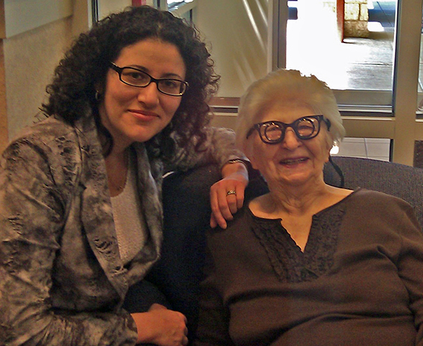 Dr. Pikus fitting low vision glasses on a patient